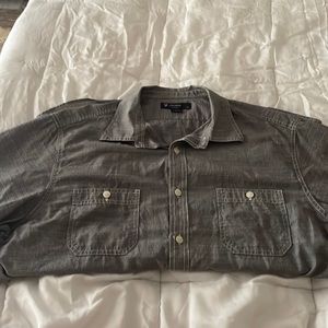 Men’s navy and white short sleeve button up shirt.